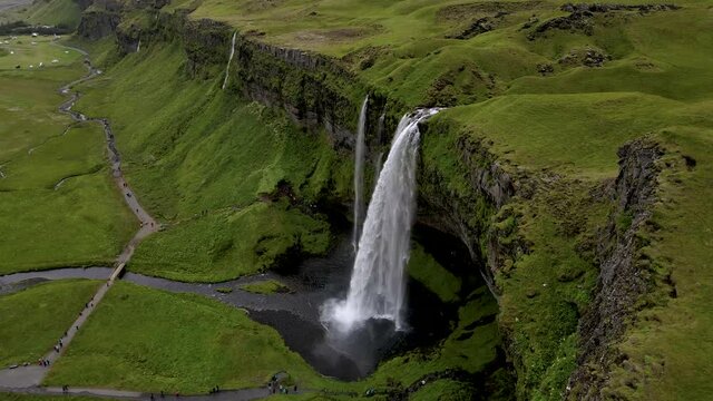 Cinematic aerial footage of the Beautiful Seljalandsfoss and Gljufrabui waterfalls in Iceland on summer