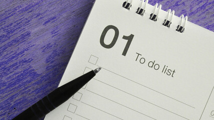 Pen on Fisrt Month To do List on Violet Background in Banner Size Image
