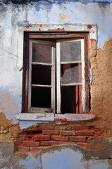 Fototapeta na wymiar Close Up of Open Window in Old Derelict Brick Building 