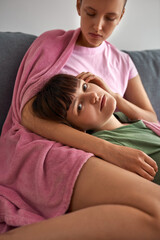 Girl caress girlfriend who lay in her embracing