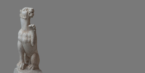 Banner with ancient marble statue of scary panther of Roman Renaissance Era at solid gray...