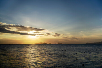 Beautiful scene of seascape during the Sunrise time. Very nice clouds and sun light at the beautiful beach of Thailand.
