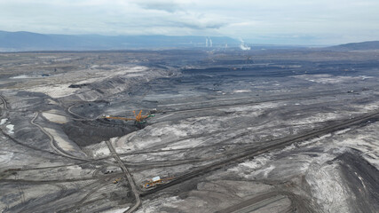 Brown coal opencast mine bucket wheel excavator giant Vrsany, aerial video shot view, open pit...