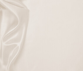 Fototapeta premium Smooth elegant golden silk or satin luxury cloth texture as wedding background. Luxurious background design. In Sepia toned. Retro style