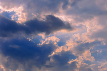 Naklejka na ściany i meble The beautiful overcast sky of the setting sun