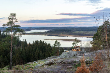 Obraz premium Republic of Karelia, view from Mount Paasonvuori. Green coniferous forest and clouds. The concept of privacy from the noise in nature.