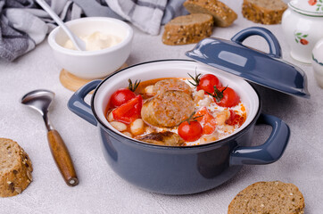 Beans soup with vegetables and sausages