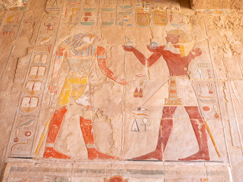 Ancient hieroglyphs and drawings in the temple of Queen Hatshepsut.