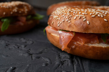Bagels with salmon and arugula, healthy snack, proper nutrition