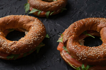 Bagels with salmon and arugula, healthy snack, proper nutrition