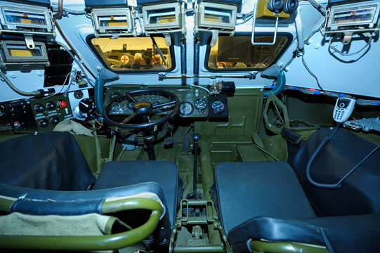 Driver-mechanic cabin of Ukrainian combat reconnaissance vehicle BRDM 2: seat, wheel, dashboard