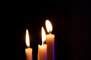 Fototapeta premium burning candle in the dark