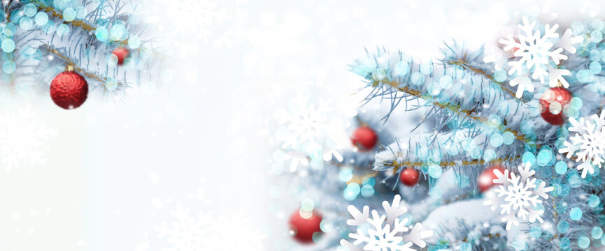 Christmas tree background with shiny blurred light, red xmas balls decoration in fir tree with copy space