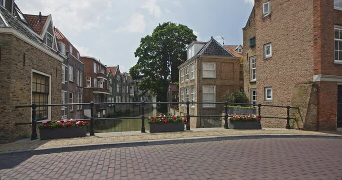 POV shot, walking along Stadshuisplein in Dordrecht, the Netherlands without any people on the street. Sunny summer day.