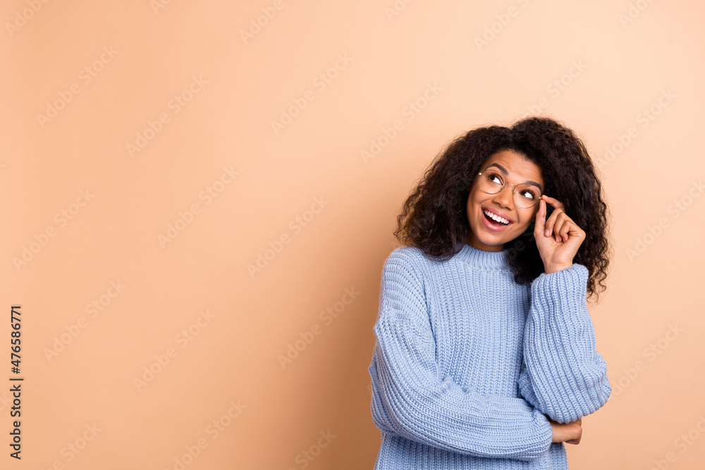 Sticker Photo of young curious girl look empty space dream think imagination isolated over beige color background