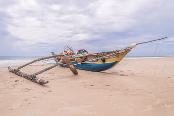 Obraz premium Wooden fishing boat at the sealandscape.