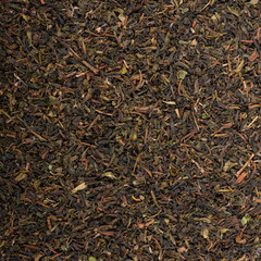 Black tea on a white background. Tea pouring. Whole leaf tea