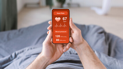 Unrecognizable man checking his health after waking up