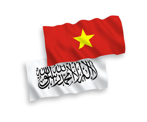 National vector fabric wave flags of Taliban and Vietnam isolated on white background. 1 to 2 proportion.