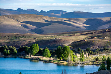 Lake Tislit in Morocco. A view of the Atlas Mountains behind the shores of the lake.