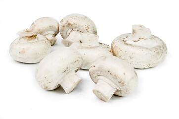 Heap of champignon mushrooms. Isolated on white background