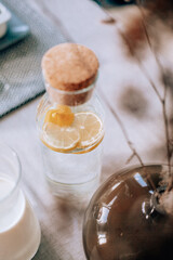 Fototapeta na wymiar glass bottle with lemon water