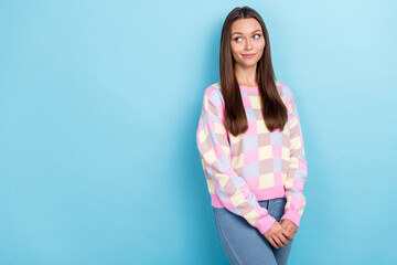 Photo of lovely positive dream lady look empty space wear casual sweater jeans isolated blue color background