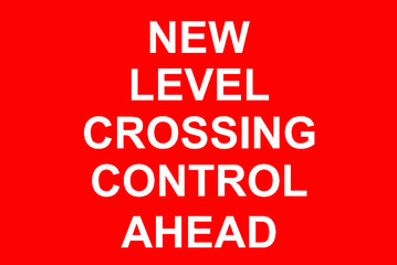 Level crossing traffic sign where trains cross roads at the same level