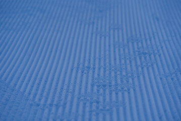 Close-up of pattern in the snow after reparation of slope by snowcat at mountain village Stoos, Canton Schwyz, on a sunny winter day. Photo taken December 20th, 2021, Stoos, Switzerland.