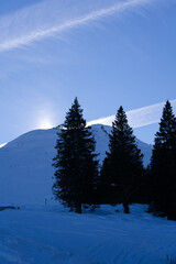 Panoramic view of mountains seen from mountain Klingenstock on a sunny winter day. Photo taken December 20th, 2021, Stoos, Switzerland.