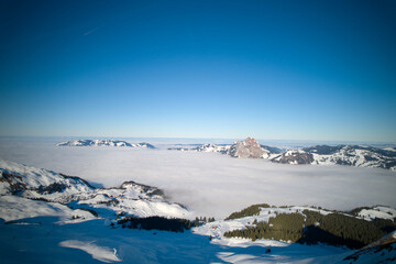 Panoramic view of mountains seen from mountain village Stoos, Canton Schwyz, on a sunny winter day. Photo taken December 20th, 2021, Stoos, Switzerland.