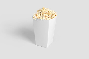 Popcorn in white cardboard bucket or box mockup isolated on white background. 3d rendering.