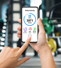 Cropped of woman checking daily activity while exercising at gym
