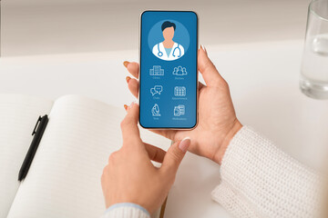 Cropped of woman connecting doctor via medical service on smartphone