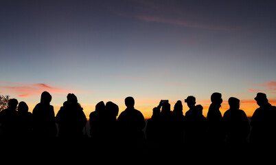 Fototapeta premium Silhouette scenery of group of tourists in the morning.
