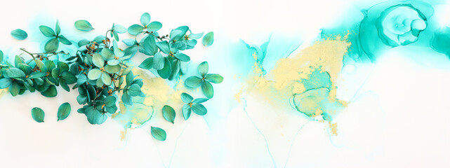 Fototapeta na wymiar Creative image of emerald and green Hydrangea flowers on artistic ink background. Top view with copy space