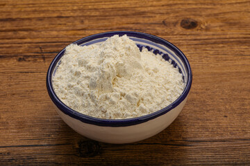 Wheat flour heap in the bowl