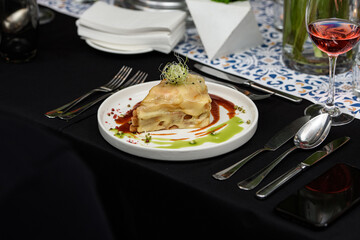 Francesinha, traditional Portuguese sandwich originally from Porto. Served in a restaurant