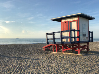 Cocoa Beach Lifeguard house in a sunnny day photo - Powered by Adobe