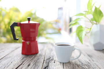 Red moka pot and coffee cup