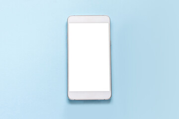 White smartphone with white empty screen lay on a blue background mockup. top view