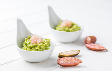 Fresh guacamole with caviar lime (Australian finger lime) fruits