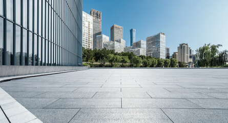 Panoramic skyline and modern commercial office buildings with empty square floors
