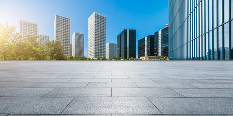 Fototapeta na wymiar Panoramic skyline and modern commercial office buildings with empty square floors