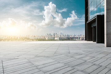 Panoramic skyline and modern commercial buildings with empty square floors
