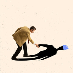Contemporary art collage of businessman holding hand of his shadow and helping it to stand up