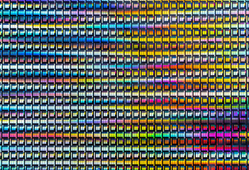 silicon chip wafer reflecting different colors