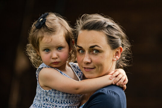 A Portrait Of Two Year Old Girl With Her Mother.