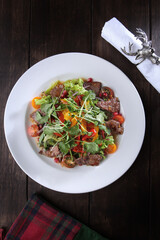 Seafood salad in cheese sauce. Flat lay.Top view.Copy space. Menu for a restaurant or cafe.Vertical photo.Festive serving.New Year or Christmas.