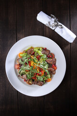 Seafood salad in cheese sauce. Flat lay.Top view.Copy space. Menu for a restaurant or cafe.Vertical photo. Festive serving.